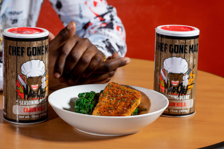 Cajun salmon served with sautéed greens, seasoned with Chef Gone Mad Cajun NOLA seasoning blend.